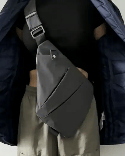 Zipping a jacket over the FlyHugz Anti-Theft Bag so it disappears